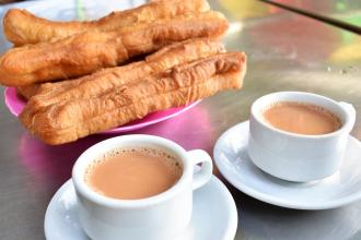 Tea house breakfast with sweet tea and Burmese donuts