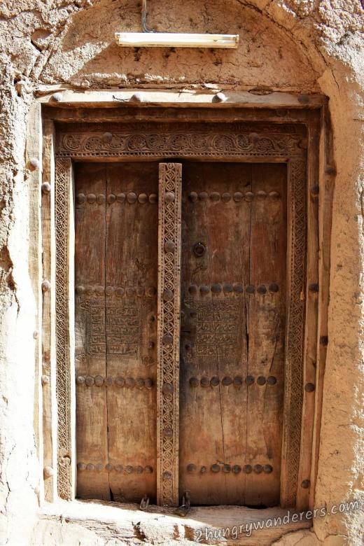 Well preserved carved door at Al Hamra